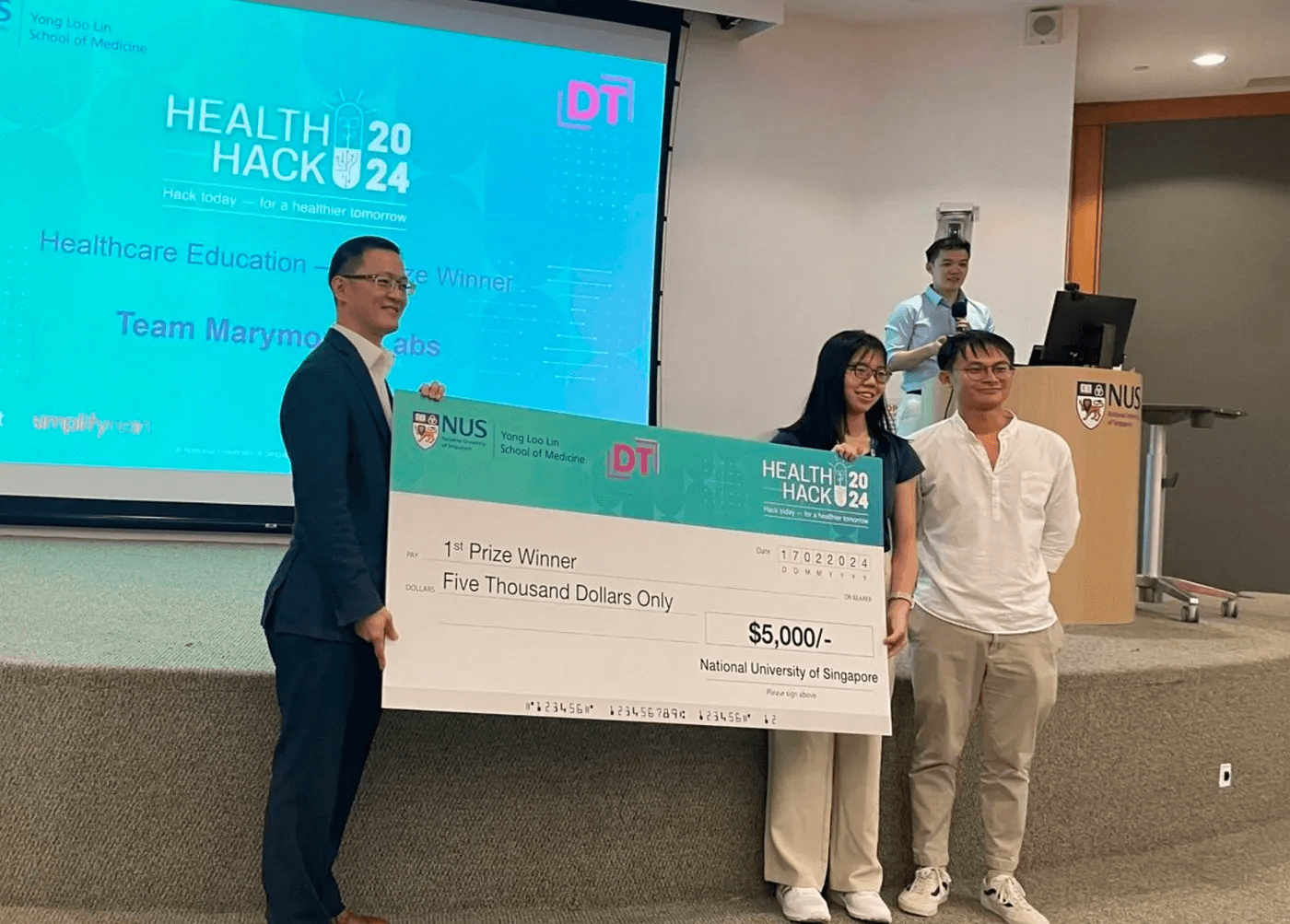 Team Marymount Labs receiving first prize at NUS Medicine HealthHack 2024